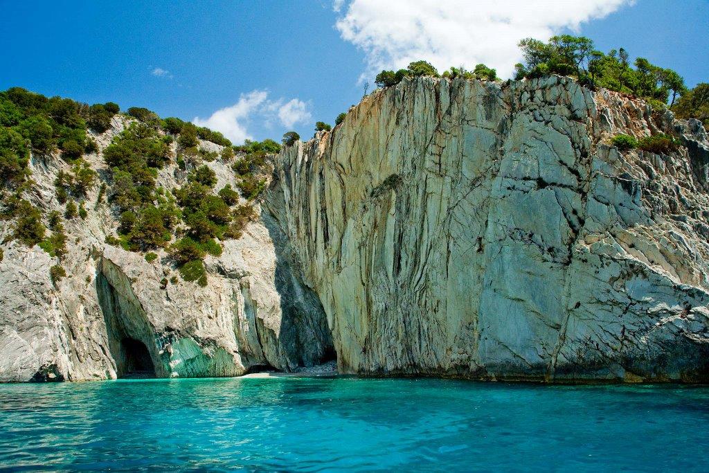 photo of a blue sea and mountains