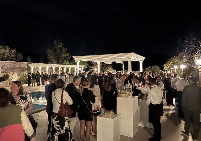 cocktail party at night with people in a venue 